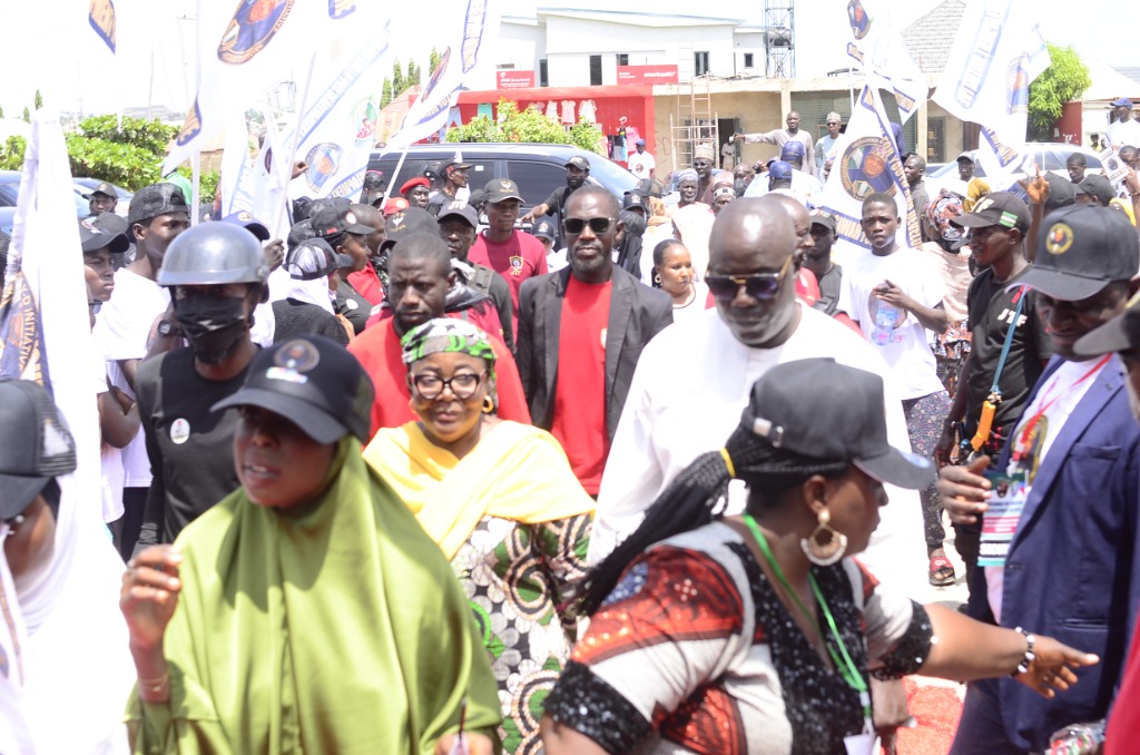 MUSAWAH 4 Y-D Initiative community supporters and mobilizers marching with flags during the inauguration celebration in Kaduna